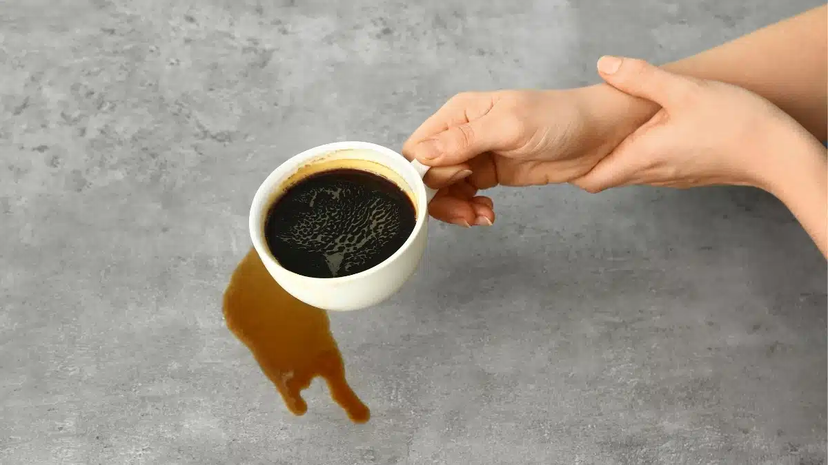 Difficulty in holding cup due to hand tremors