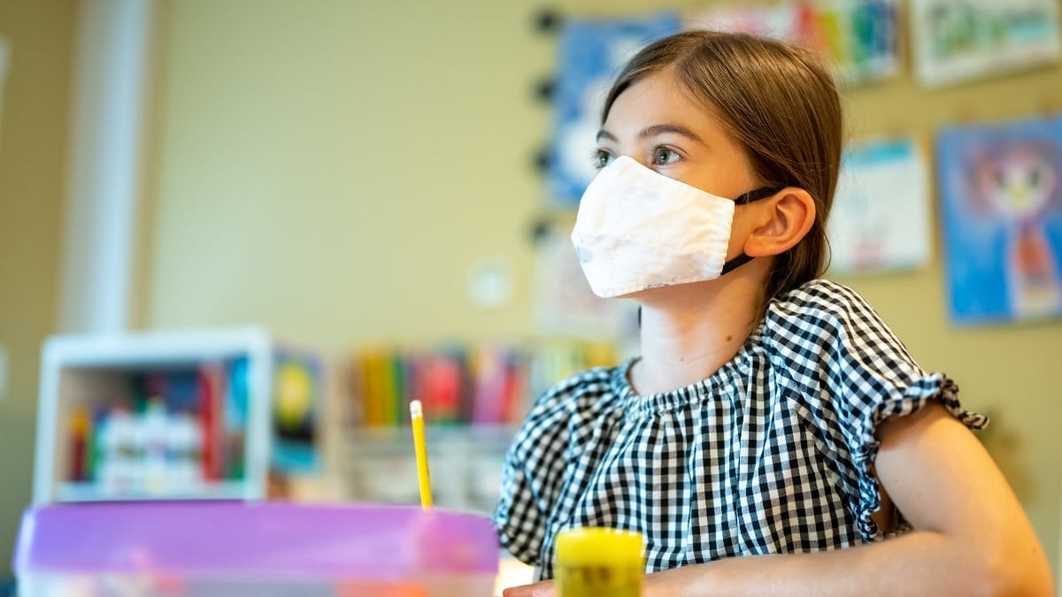 Student wearing mask in classroom due to COVID-19