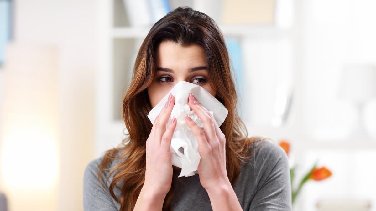 Woman suffering from symptoms of influenza