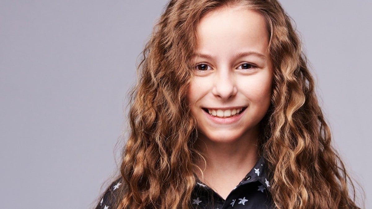 Smiling teenage girl with white and brown hair