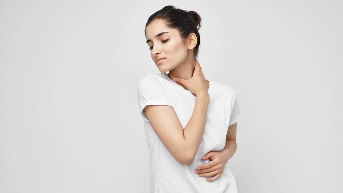 Woman suffering from pain the jaw and neck