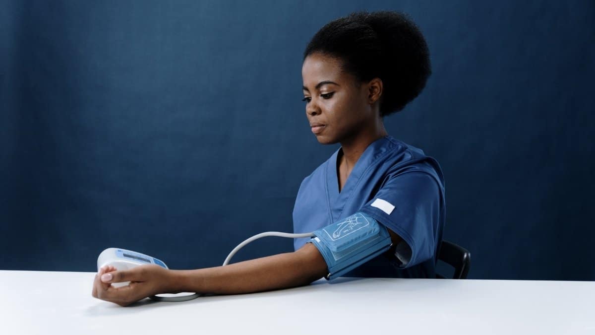 Woman testing high blood pressure