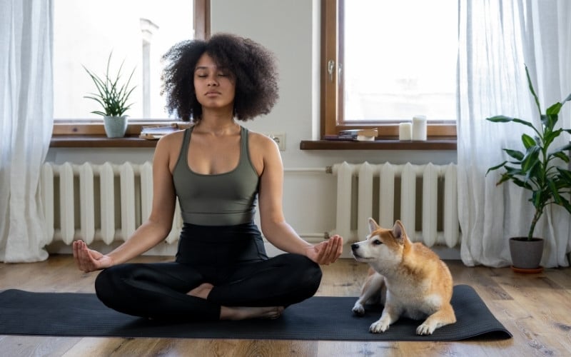 Woman meditating to reduce overthinking