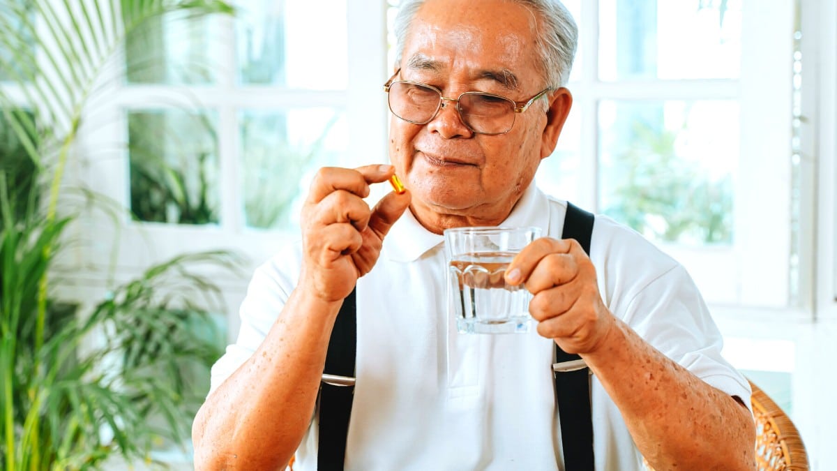 Man eating pill