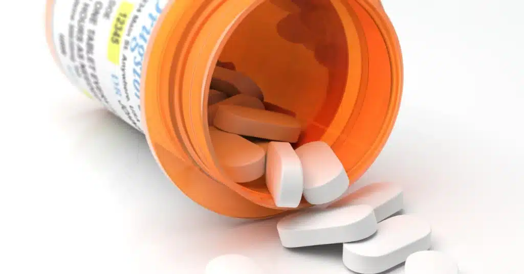 pills spilling out of orange container
