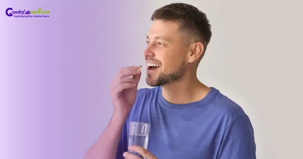 a man taking a pill 