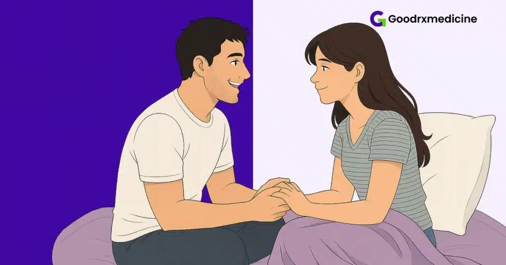 Smiling couple sitting close on bed