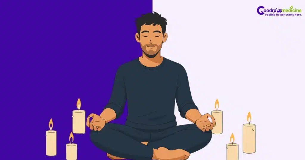 Person meditating in dimly lit room with candles