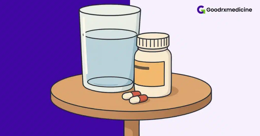 Glass of water with pills