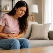 Woman experiencing worsening PMS cramps and abdominal pain