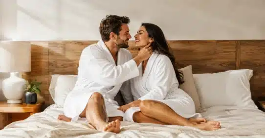 Romantic couple using touch to build female arousal