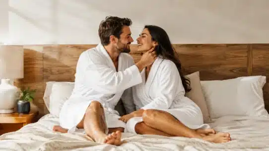 Romantic couple using touch to build female arousal